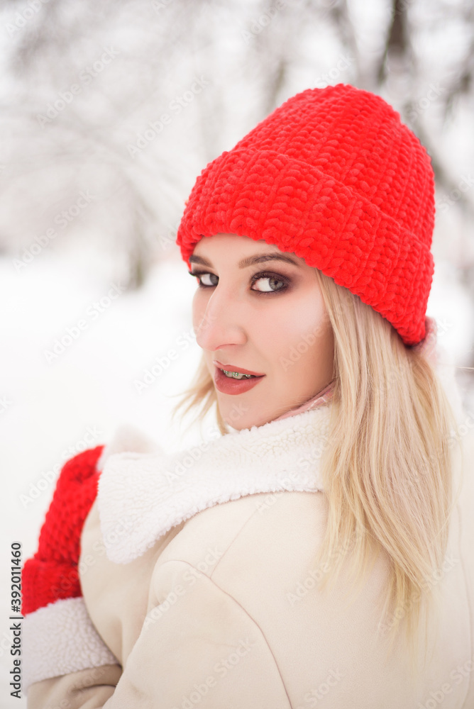 Young beautiful girl outdoors in the winter city. Young beautiful girl outdoors in the winter city.