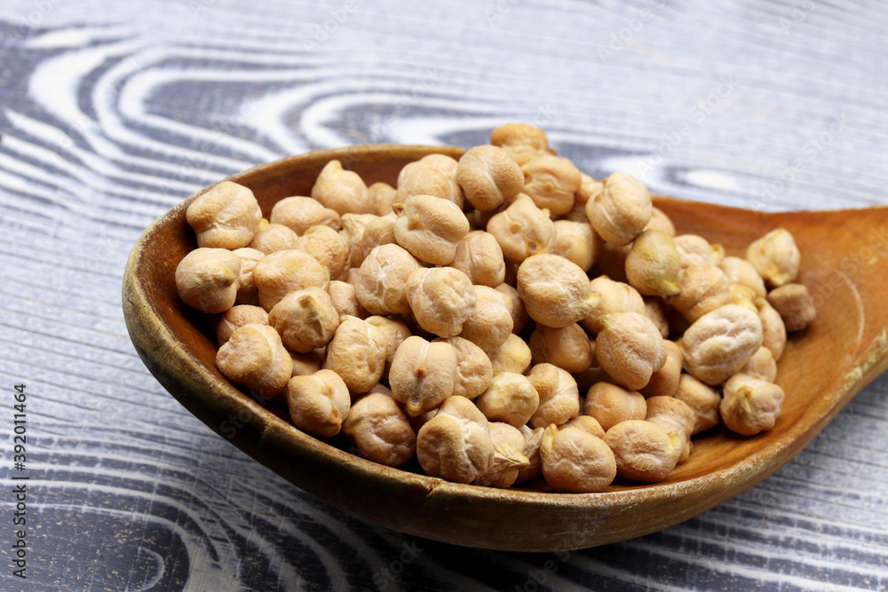 organic dried chickpeas on wooden background organic dried chickpeas on wooden background