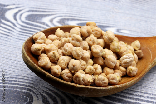 organic dried chickpeas on wooden background