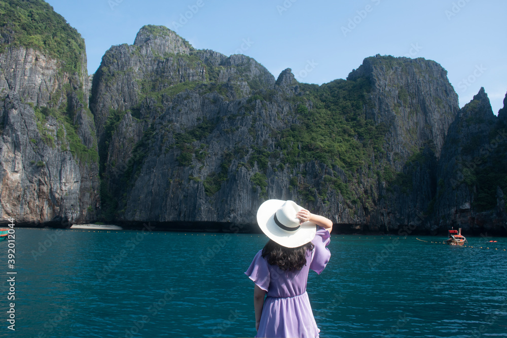 Woman traveler looking to Maya Bay on Phi Phi Leh Island, Krabi Province.