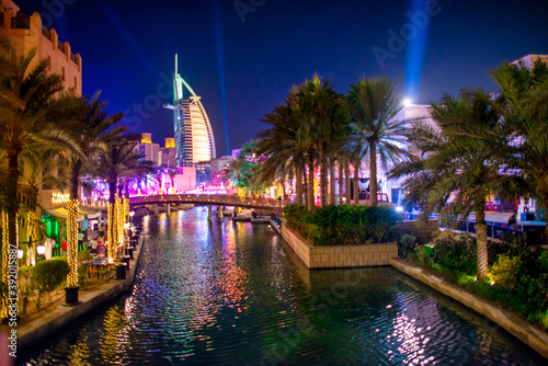 DUBAI, UAE - DECEMBER 9, 2016: Madinat Jumeirah and Burj Al Arab at night