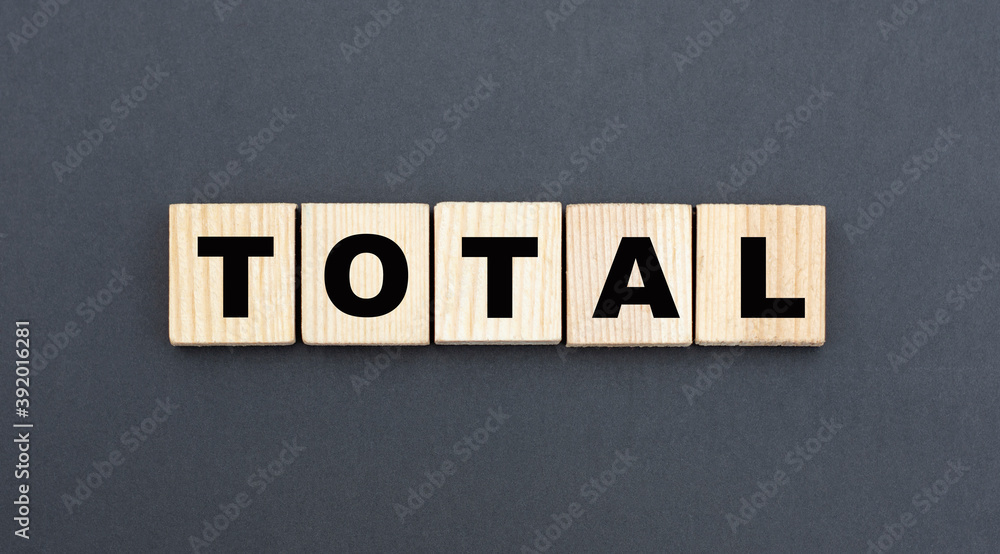 Obraz premium concept word TOTAL on wooden cubes on a gray background