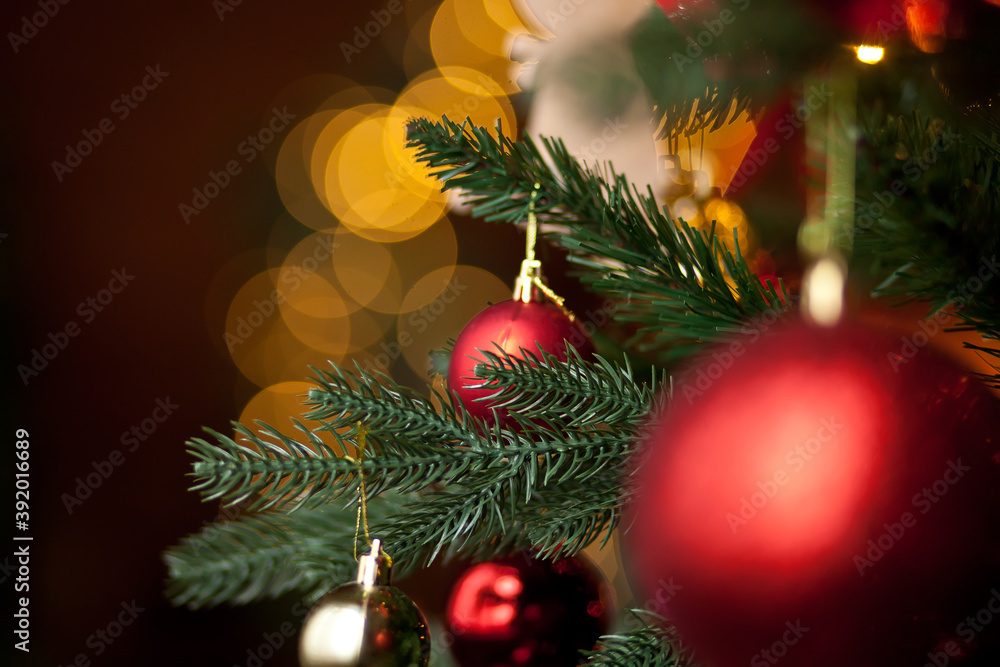 Decorated Christmas tree with bokeh on the background.