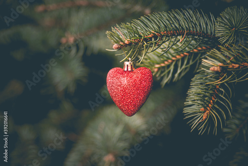 Good New Year spirit. Christmas tree toy in the form of a heart.