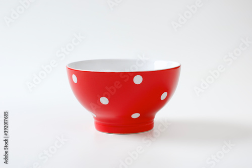 Empty red and white polka dot bowl