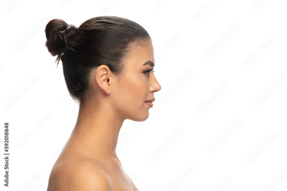 Profile. Portrait of beautiful young woman on white studio background. Concept of cosmetics, makeup, natural and eco treatment, skin care. Shiny and healthy look, fashion, healthcare. Copyspace. Profile. Portrait of beautiful young woman on white studio background. Concept of cosmetics, makeup, natural and eco treatment, skin care. Shiny and healthy look, fashion, healthcare. Copyspace.