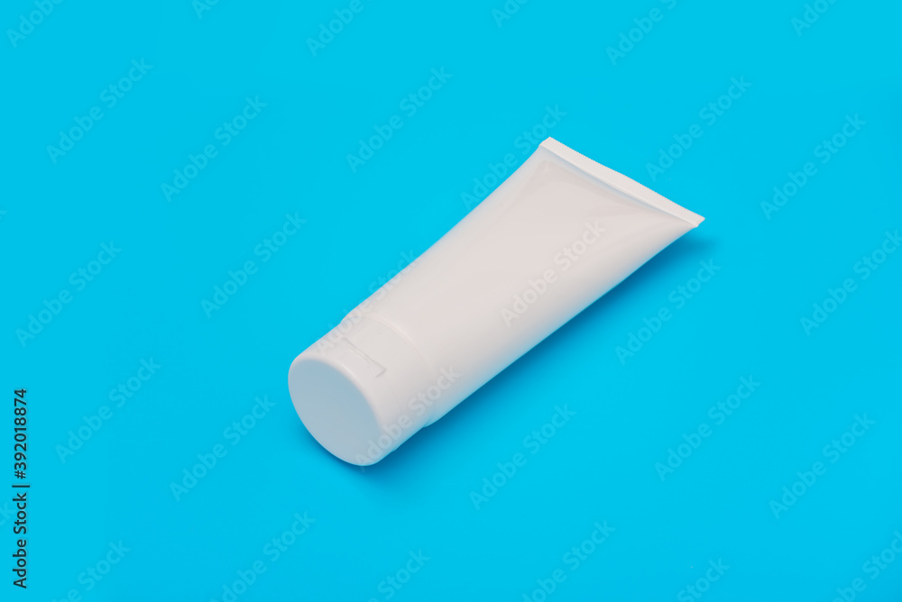 Blank white tube design on a blue background. Mockup Blank white tube design on a blue background. Mockup