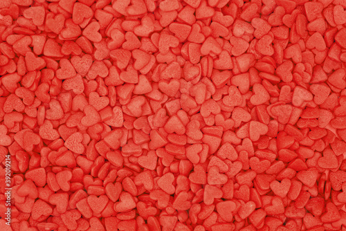 Background from red small hearts. Concept valentin`es day. Pattern