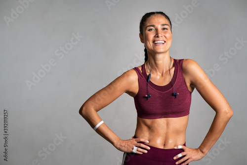 Beautiful middle aged woman laughing after workout photo