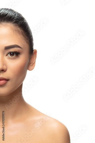 Well-kept. Portrait of beautiful young woman on white studio background. Concept of cosmetics, makeup, natural and eco treatment, skin care. Shiny and healthy look, fashion, healthcare. Copyspace.