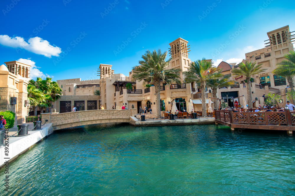 DUBAI, UAE - DECEMBER 11, 2016: View of Madinat Jumeirah old style buildings from the canals