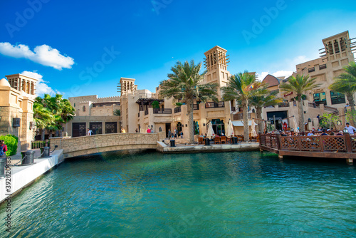 DUBAI, UAE - DECEMBER 11, 2016: View of Madinat Jumeirah old style buildings from the canals © jovannig