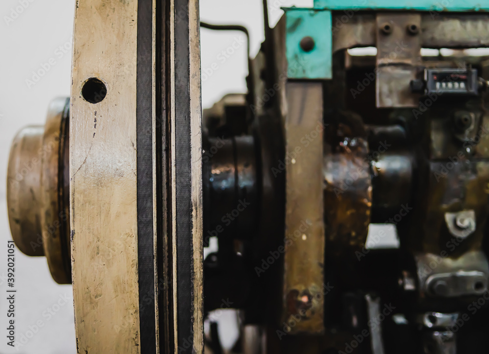 A part of the rotating lathe machine in a factory. A part of the rotating lathe machine in a factory.
