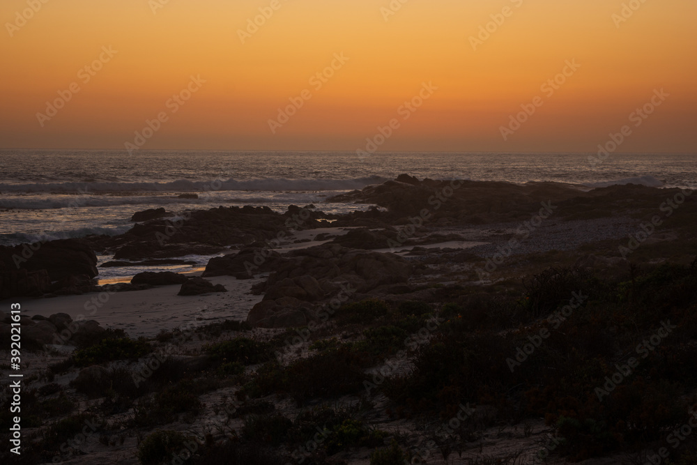 Sunset over the rocky beach in Namaqua National Park