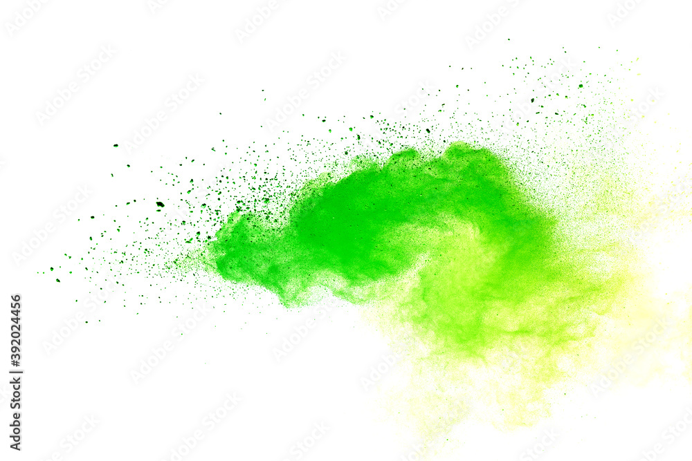 Freeze motion of green color powder exploding on white background. Freeze motion of green color powder exploding on white background.