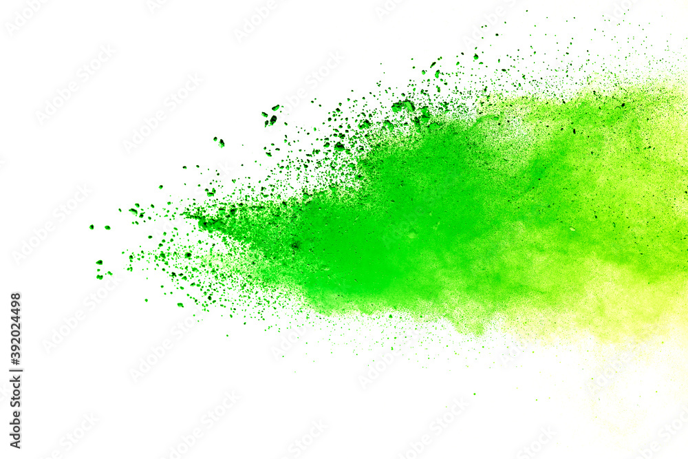 Freeze motion of green color powder exploding on white background. Freeze motion of green color powder exploding on white background.