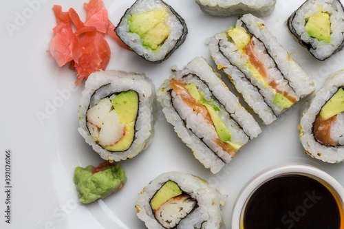 Sushi rolls and sandwiches with soy and ginger - overhead image