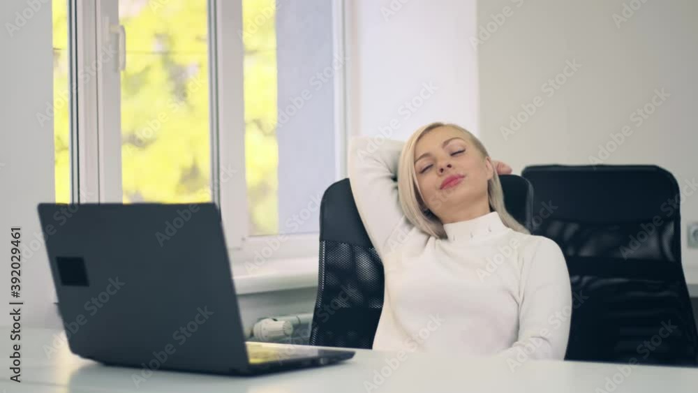 Young sucessful female freelancer leaning back in her chair and relaxing after finishing a project while remotely working at home. Pretty girl lean back and thinking Young sucessful female freelancer leaning back in her chair and relaxing after finishing a project while remotely working at home. Pretty girl lean back and thinking