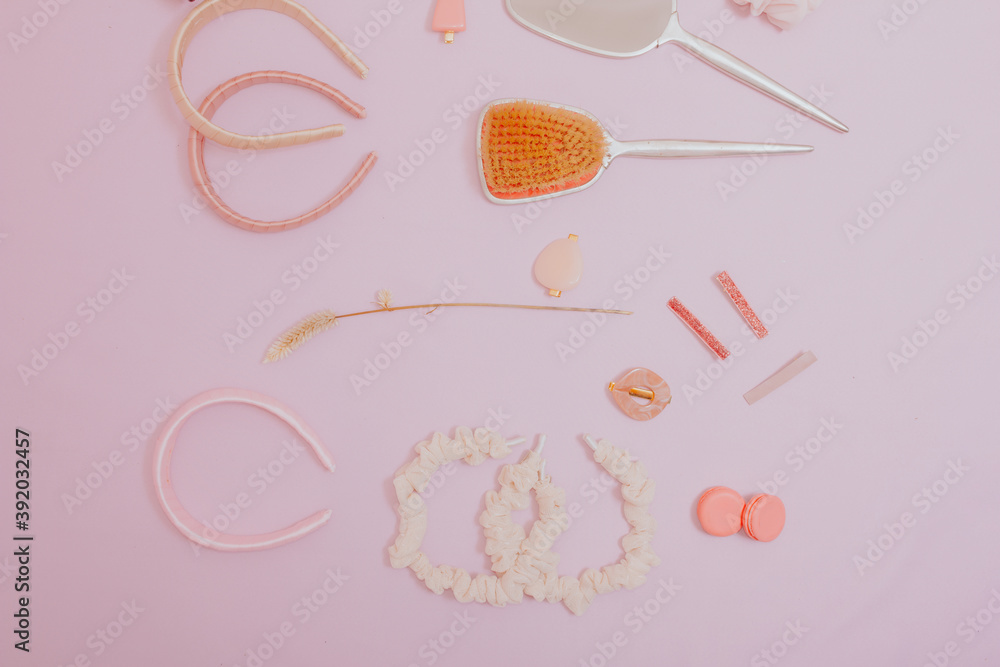 Fashion women hair accessories set with pink pastel background with copy space, above top view close up. Fashion women hair accessories set with pink pastel background with copy space, above top view close up.