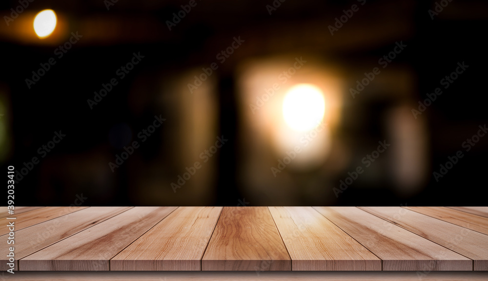 Empty wood table with blur vintage restaurant background.