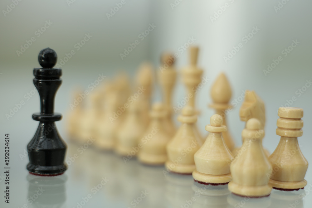 Chess pieces on a glass table Chess pieces on a glass table