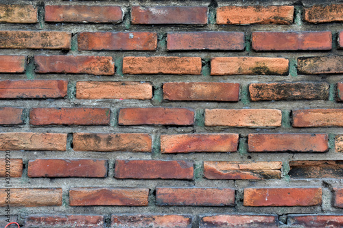 Cracked of Vintage Brick Concrete wall is a block texture background for design and decoration.
