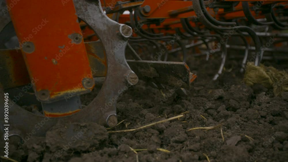 Harvesting in the field. Land cultivation with a tractor Harvesting in the field. Land cultivation with a tractor