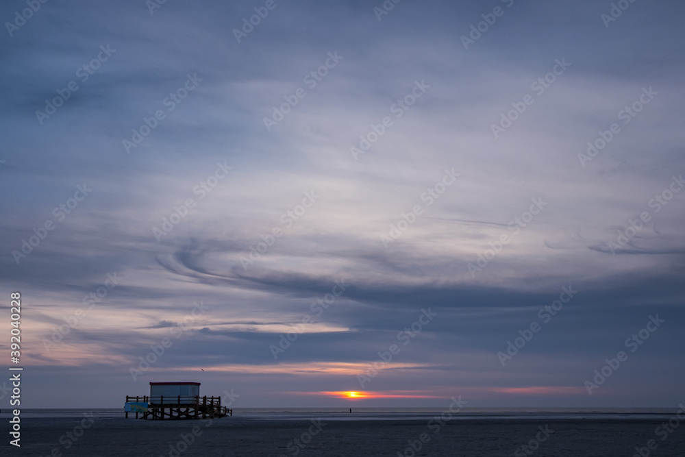 Structure on St Peter Ording beach at sunset