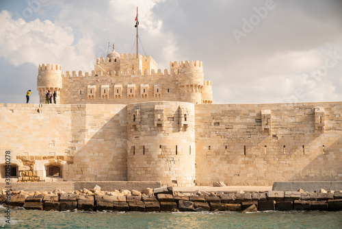 A castle surrounded by a fortress wall in Alexandria, Egypt