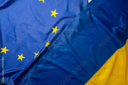 Flags of Ukraine and European Union folded together