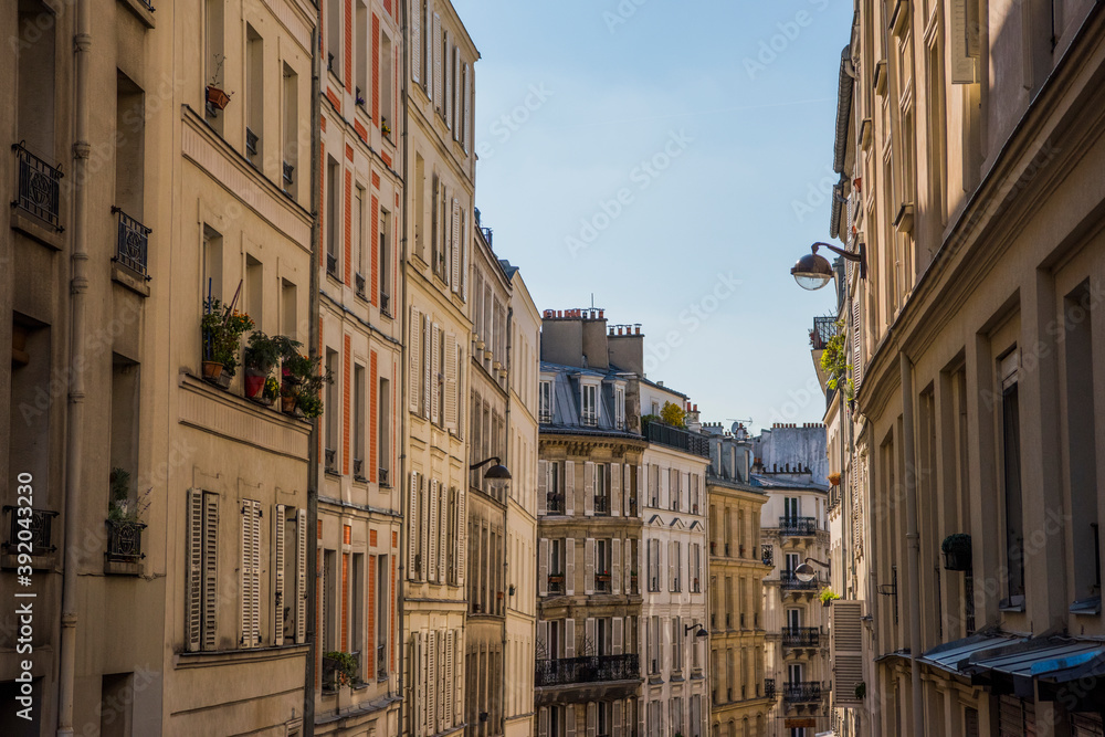 Perspective of houses on one of the streets of Paris on a bright day