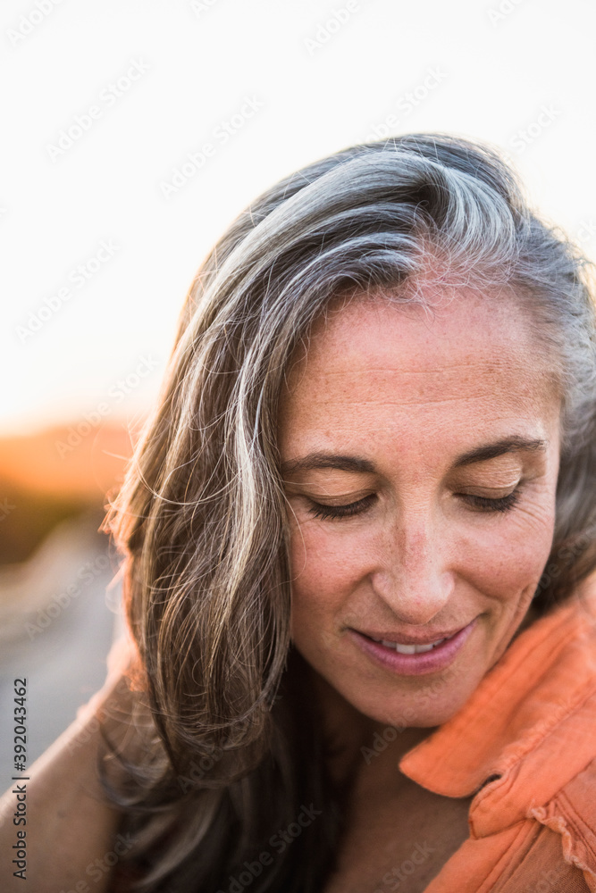 Portrait of Gray Haired Woman at the beach for sunset Portrait of Gray Haired Woman at the beach for sunset