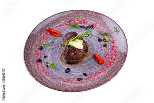 Beef with flavored herbs and cheese sauce, isolated white background.