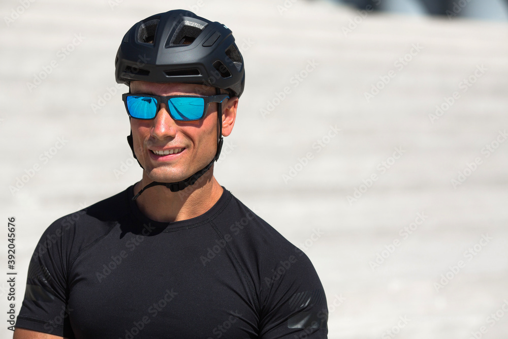 handsome young male in helmet and sunglasses handsome young male in helmet and sunglasses