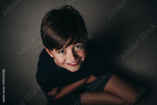 Wallpaper Mural Portrait of young smiling boy with freckles shot from above. Torontodigital.ca