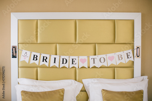 Marriage slogan written on cards. Bride to be written headboard. photo