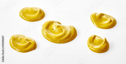 Fotografía Five dollops of mustard with different shapes