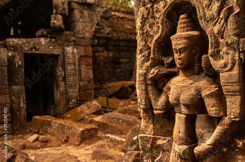 Apsara carving at the angkorian temple Ta Nei, Siem Reap, Cambodia. photo