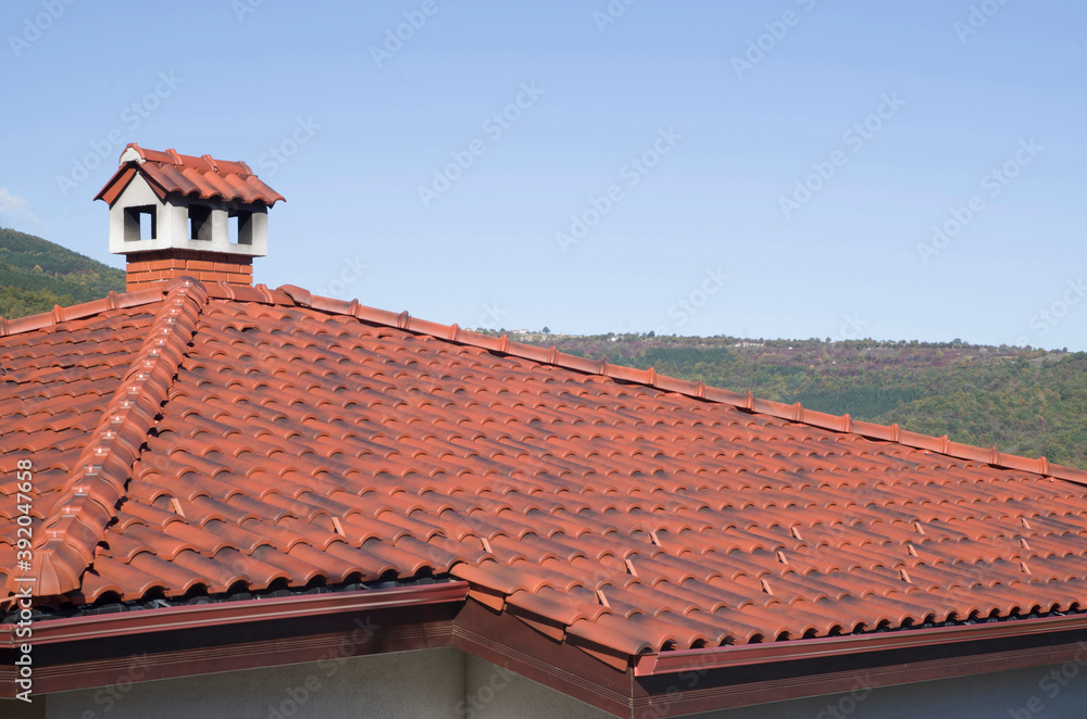 New roof with ceramic tiles and chimney