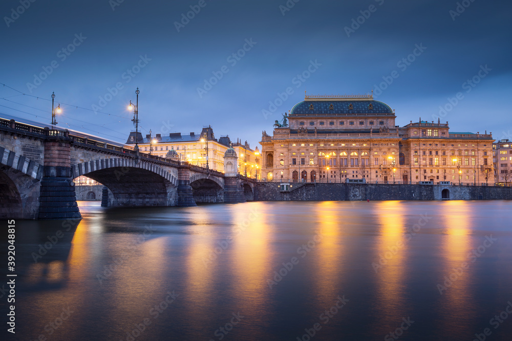 Evening view of the Legions Bridge and National Theatre in Prague.