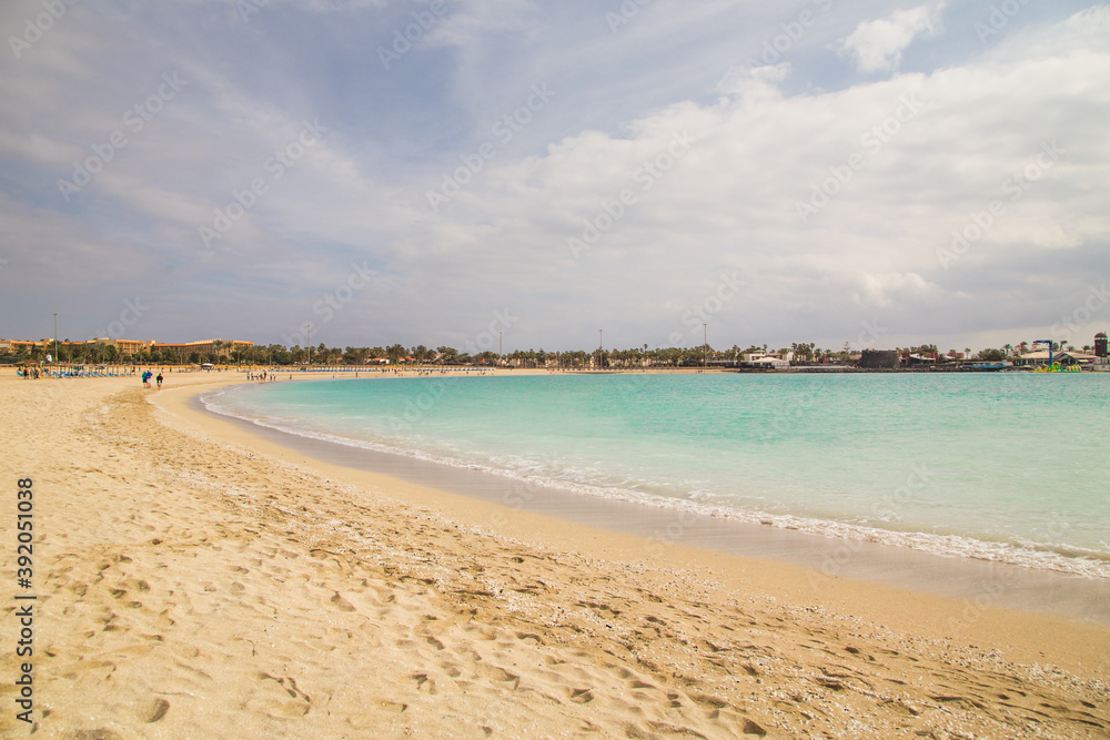 Sandy Beach of Castillo Caleta de Fuste with light blue water, Fuerteventura, Canary Islands, Spain. Sandy Beach of Castillo Caleta de Fuste with light blue water, Fuerteventura, Canary Islands, Spain.