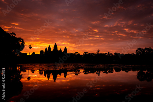 Angkor Wat, Siem Reap, Cambodia. Sunrise from reflection pool showing 5 towers of main temple. photo