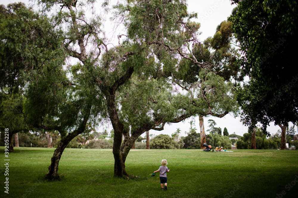 Two Year Old Running Through Park Two Year Old Running Through Park