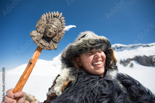 Native American hunter smiling wearing Traditional Fur clothing. photo