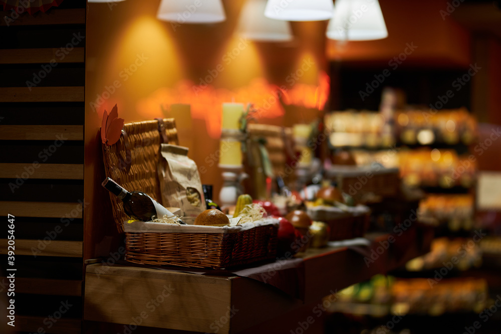 Fototapeta premium Wine basket. A beautiful wicker basket with wine.