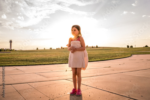 young girl with wet towel wrapped around her shivers from the cold photo