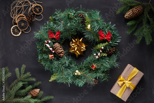 Christmas wreath on black concrete background photo