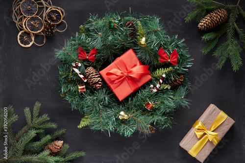 Christmas wreath on black concrete background photo