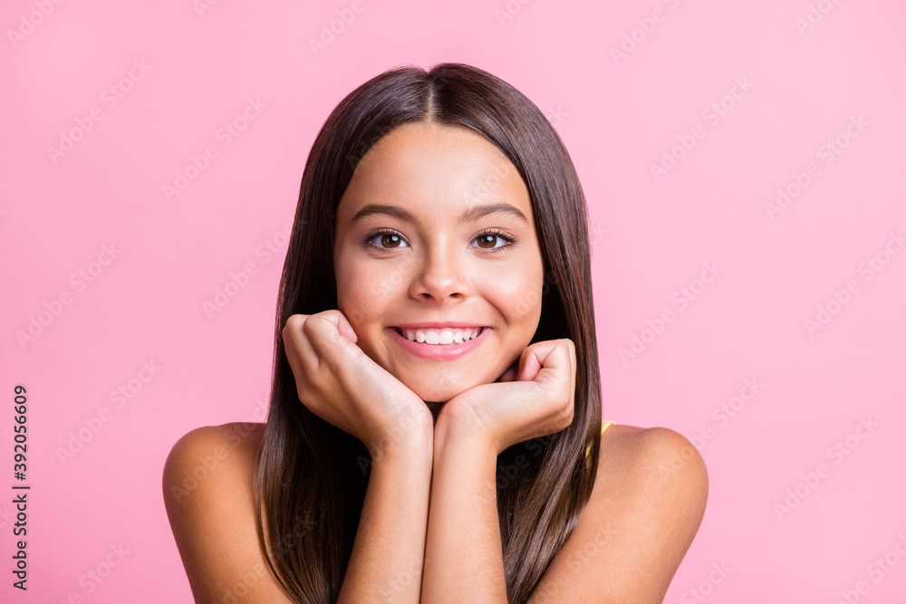 Photo of trendy little girl rest head hands beaming smile wear yellow singlet isolated on shine pink color background Photo of trendy little girl rest head hands beaming smile wear yellow singlet isolated on shine pink color background