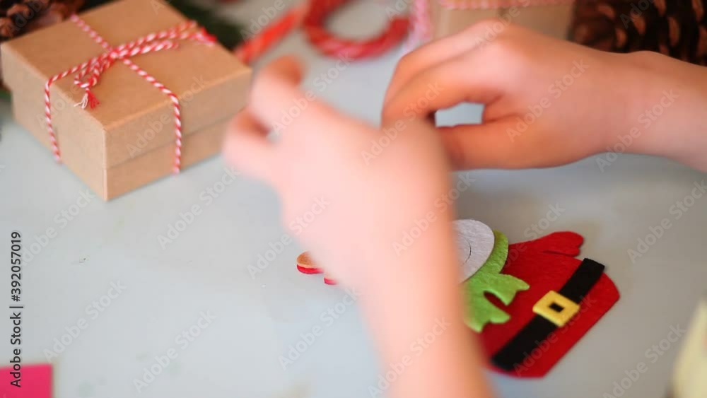Kids making decor for Christmas tree or gifts. Christmas handmade diy project Kids making decor for Christmas tree or gifts. Christmas handmade diy project